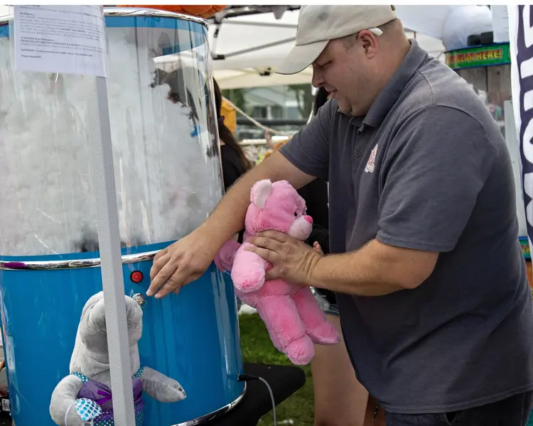 Man creating a stuffed animal.