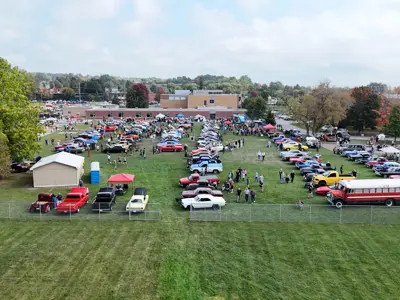 Drone photo of hundreds of cars parked at the Car Show.