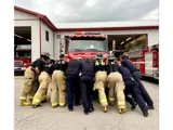 Fire Department pushing in the new pumper truck